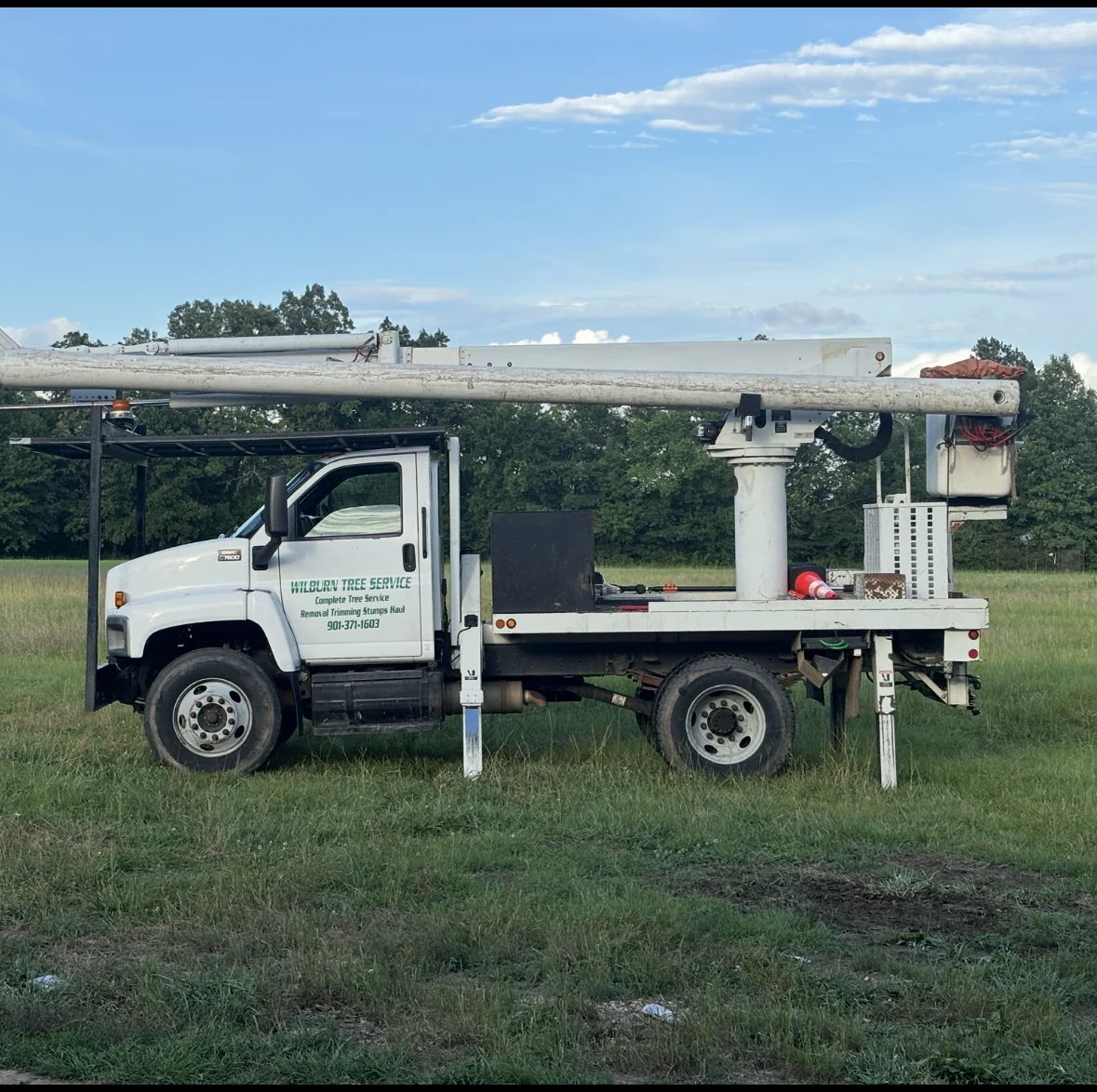 Wilburn Tree Service bucket truck on site